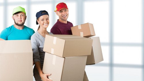 Packed household boxes and furniture ready for transport