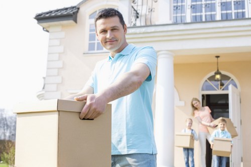 Professional movers handling furniture and boxes in central London