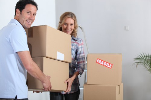 Local movers handling furniture and boxes in a Knightsbridge property